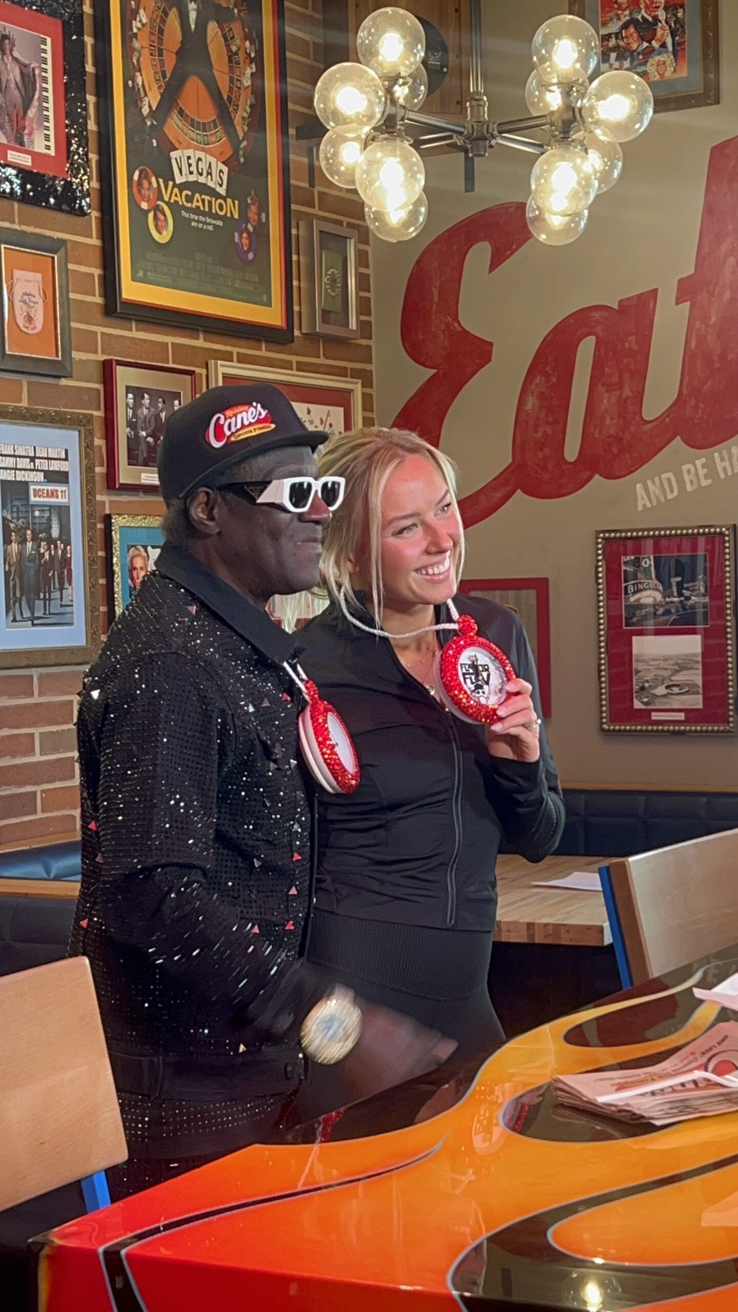 Flavor Flav and Jessica Long at Raising Cane's