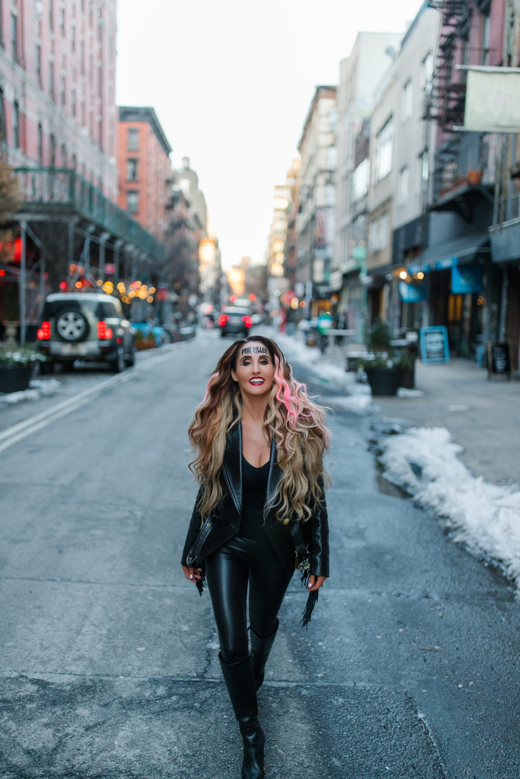 Laura Bryna walking down the street