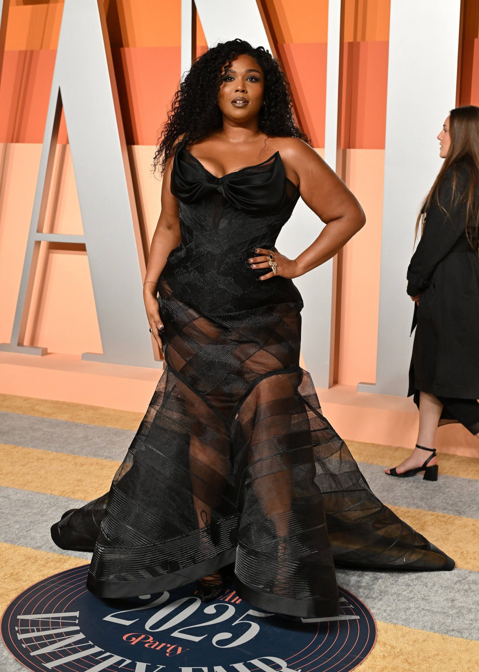 Lizzo posing on the red carpet.