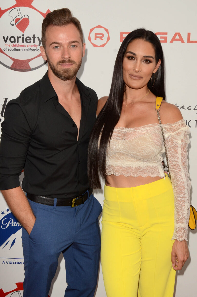 Artem Chigvintsev, Nikki Garcia attend the 9th Annual Variety Charity Poker & Casino Night