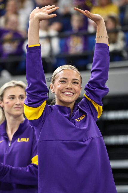 February 28, 2025: LSU's Aleah Finnegan competes on the balance beam during the Purple and Gold Podium Challenge woman's gymnastics LSU vs George Washington at the Raising Canes River Center in Baton Rouge, LA. Jonathan Mailhes/CSM. 28 Feb 2025 Pictured: February 28, 2025: LSU's Olivia Dunne is introduced to the audience prior to the Purple and Gold Podium Challenge woman's gymnastics LSU vs George Washington at the Raising Canes River Center in Baton Rouge, LA. Jonathan Mailhes/CSM. Photo credit: ZUMAPRESS.com / MEGA TheMegaAgency.com sales@mega.global (Mega Agency TagID: MEGA1276490_006.jpg) [Photo via Mega Agency]
