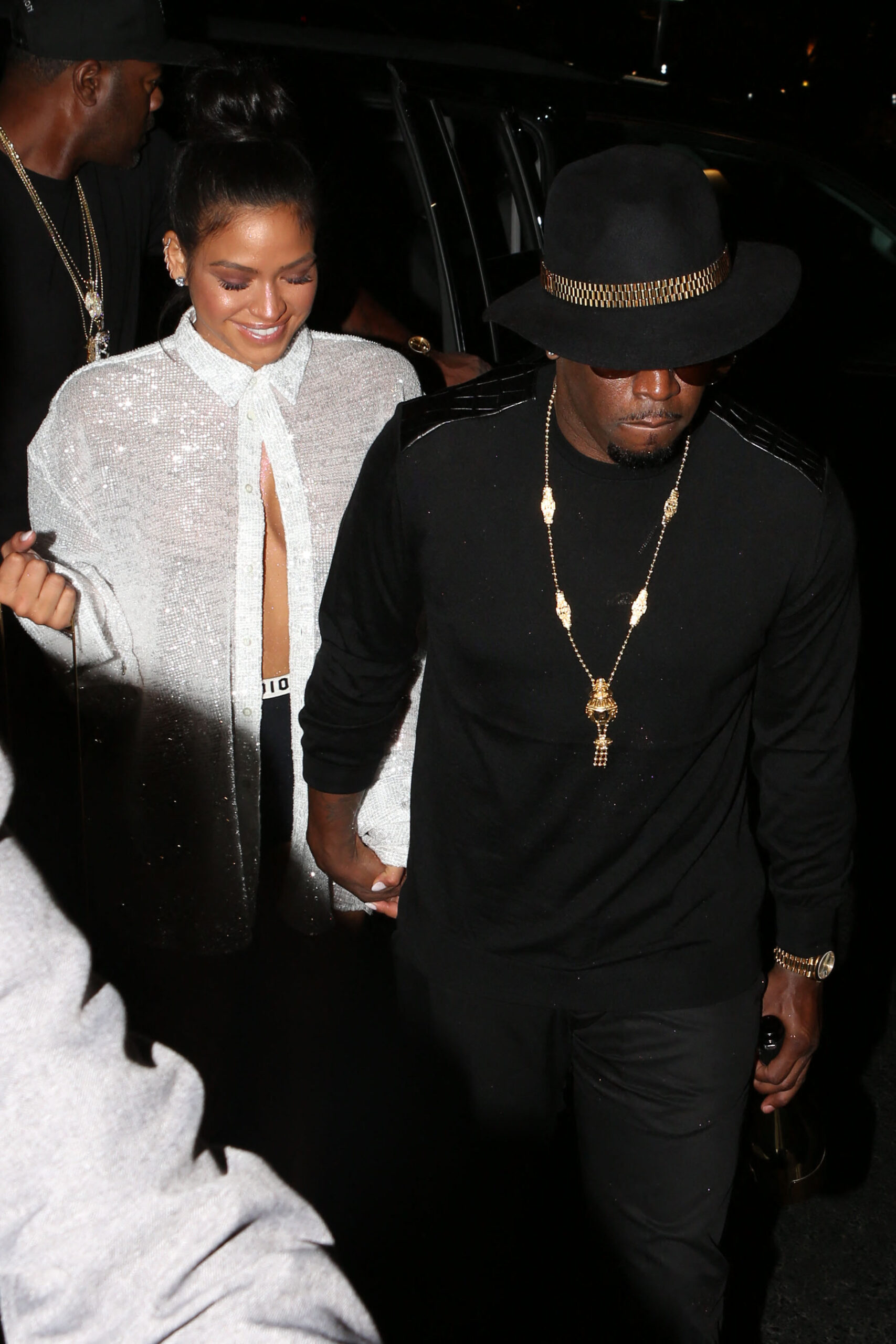 Diddy and Cassie arrive at McGregor Vs Mayweather holding a bottle of champagne