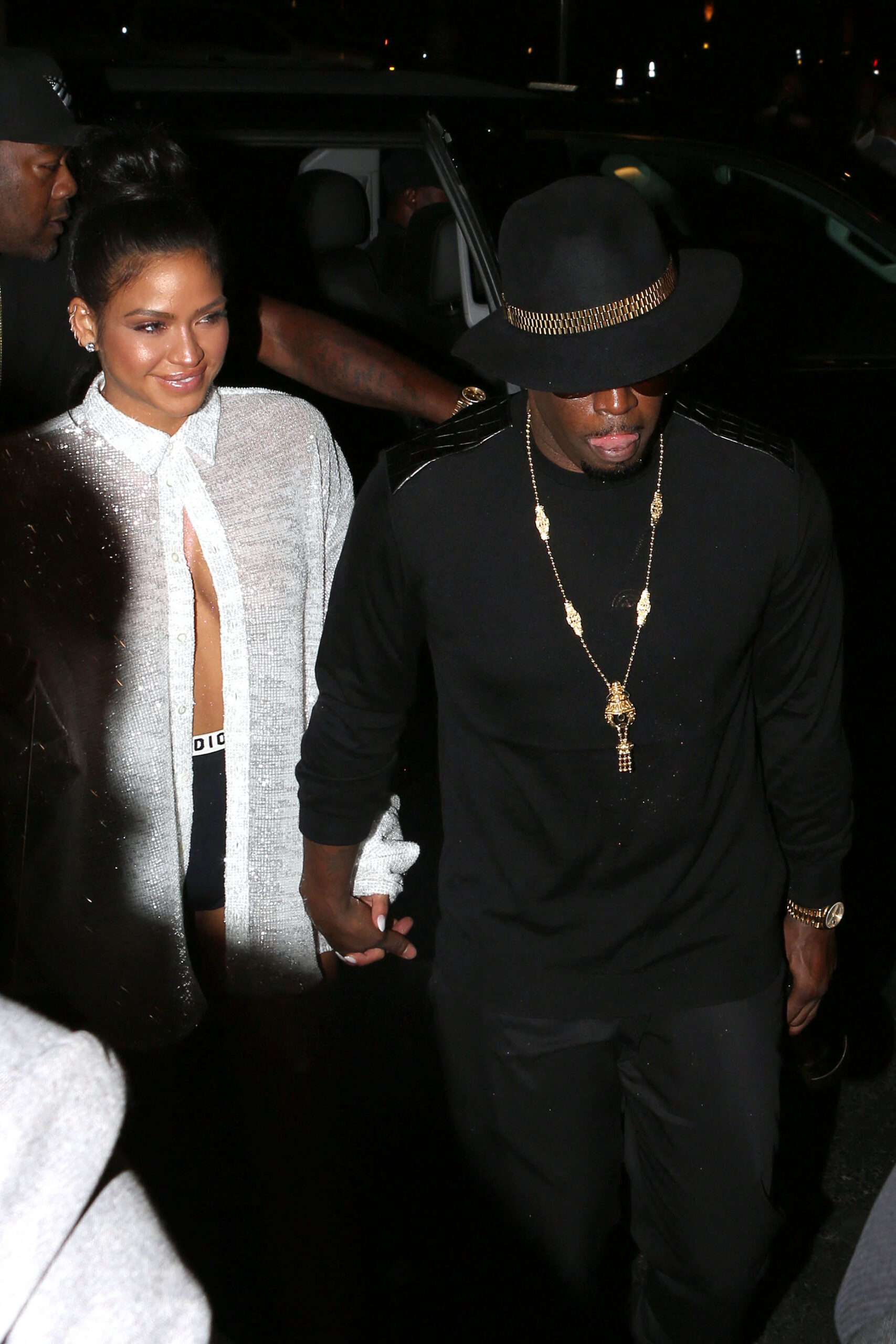 Diddy and Cassie arrive at McGregor Vs Mayweather holding a bottle of champagne