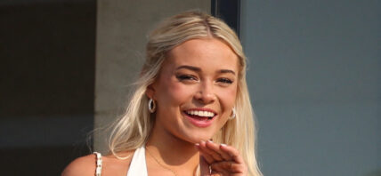 Olivia Dunne appears on a balcony at the home of Michael Rubin where he and Travis Scott are hosting the 4th July White party in Bridgehampton, New York. 04 Jul 2024 Pictured: Olivia Dunne,. Photo credit: MEGA TheMegaAgency.com +1 888 505 6342 (Mega Agency TagID: MEGA1162236_003.jpg) [Photo via Mega Agency]