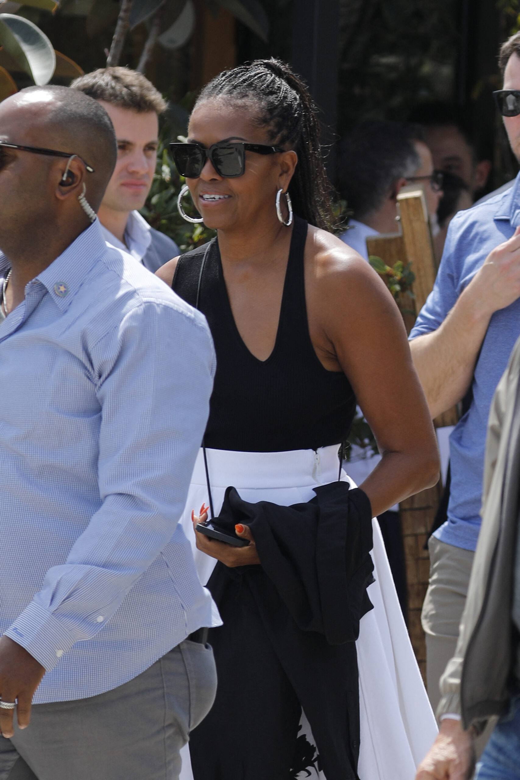 Barack Obama and Michelle Obama walk through Barcelona after visiting the Moco museum and eat with the Spielberg`s.