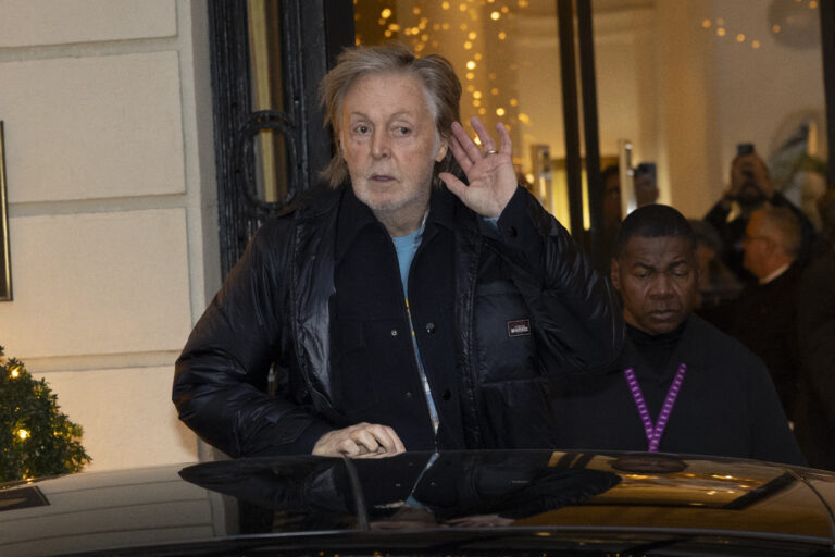Paul McCartney leaves the hotel where he is staying in Madrid