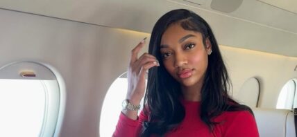 Angel Reese posing on a private jet.