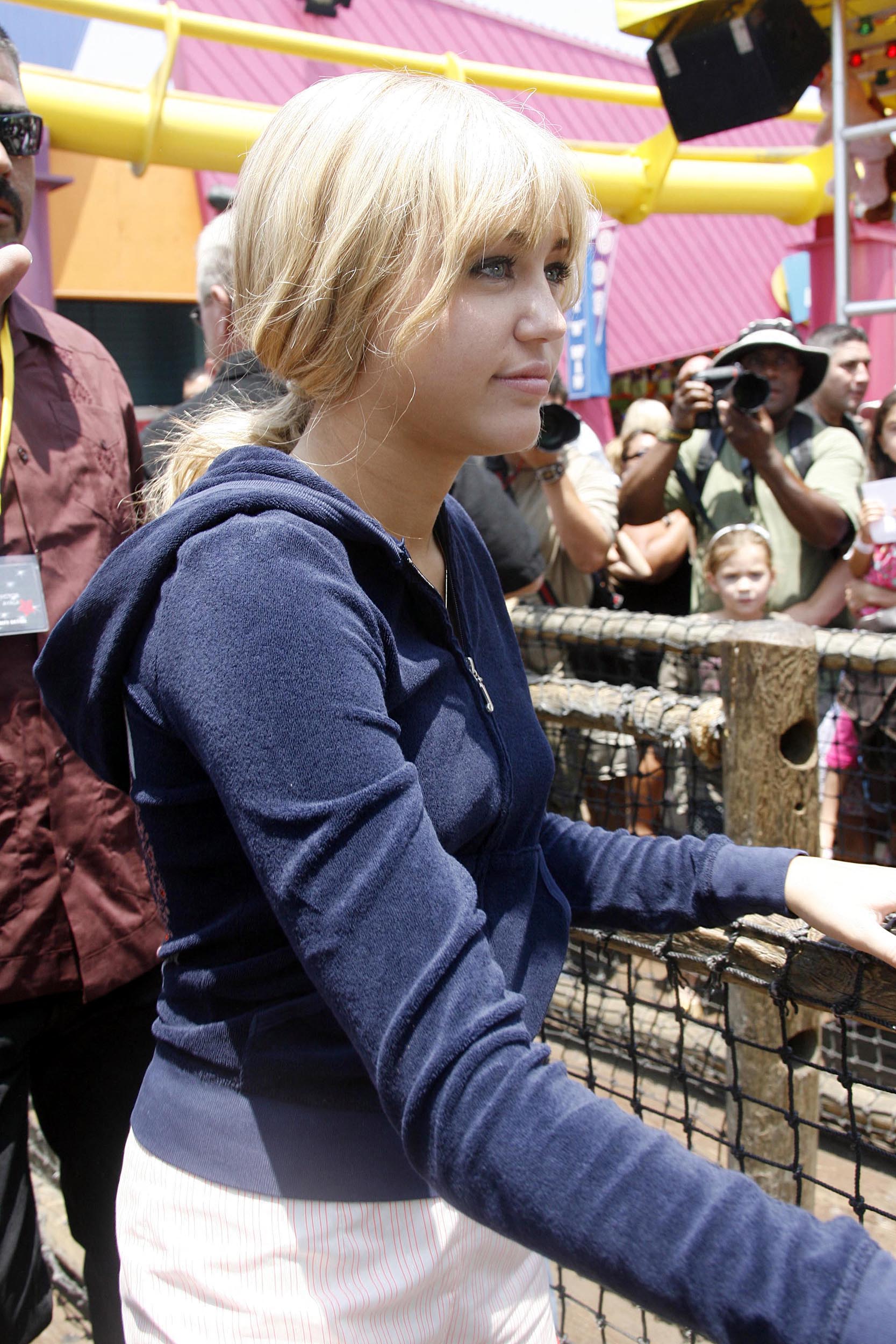 Miley Cyrus as Hannah Montana