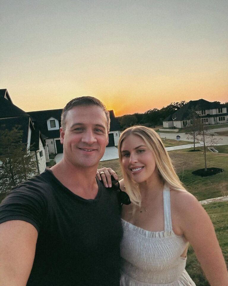 Kayla Reid and Ryan Lochte posing together for a selfie.