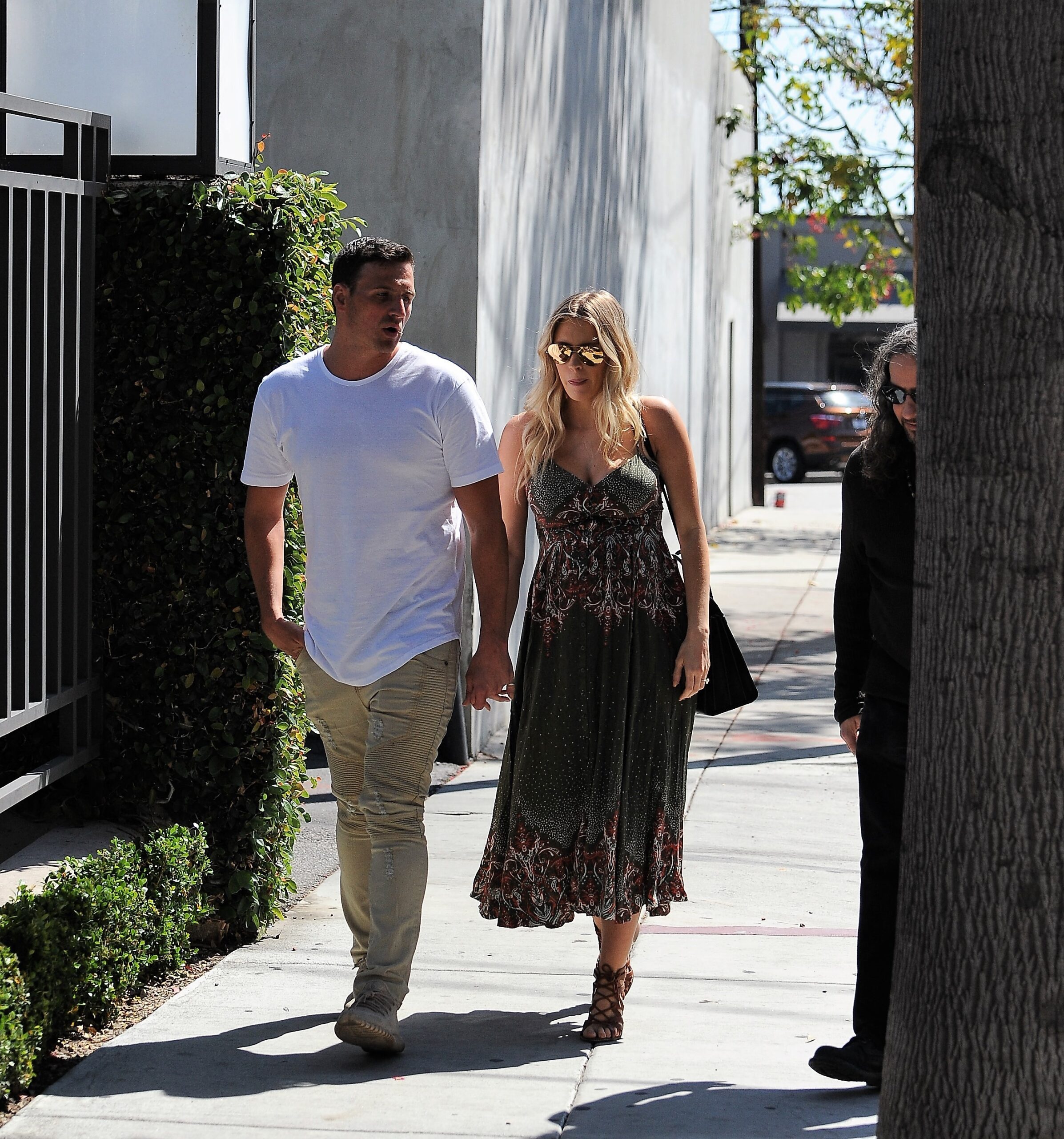 Swimmer Ryan Lochte heads out to lunch at Gracias Madre with his wife Kayla Rae Reid in Hollywood, California.