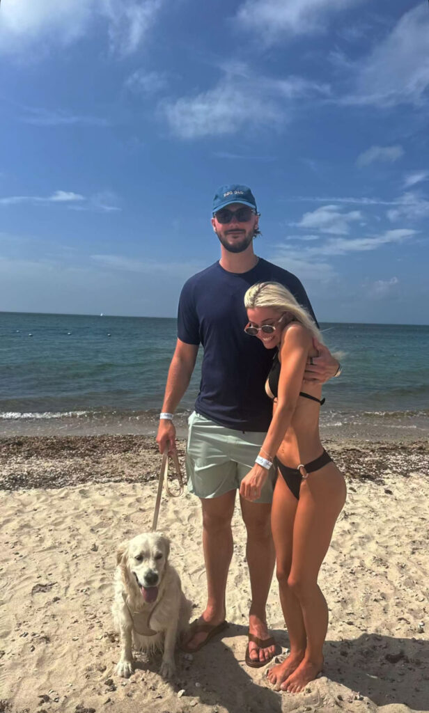 Olivia Dunne strikes a pose for the camera with her boyfriend Paul Skenes and their dog Roux. 