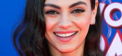 Mila Kunis smiles close up