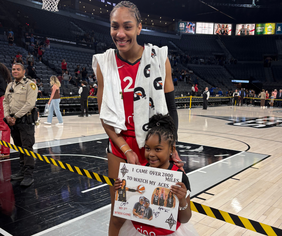 A'ja Wilson with young fan 