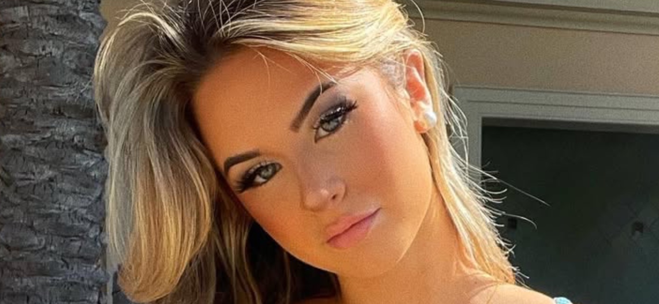 Emily Elizabeth In World’s Smallest Bikini Gets Cheeky On The Beach