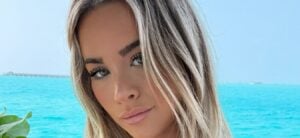 Emily Elizabeth Impresses Poolside In Cut-Out Swimsuit