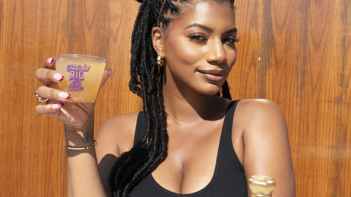 Taylor Rooks holding a Crown Royal drink