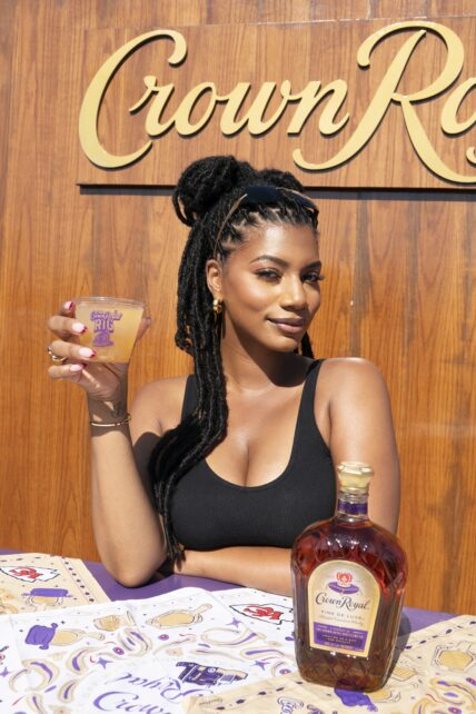 Taylor Rooks holding a Crown Royal drink