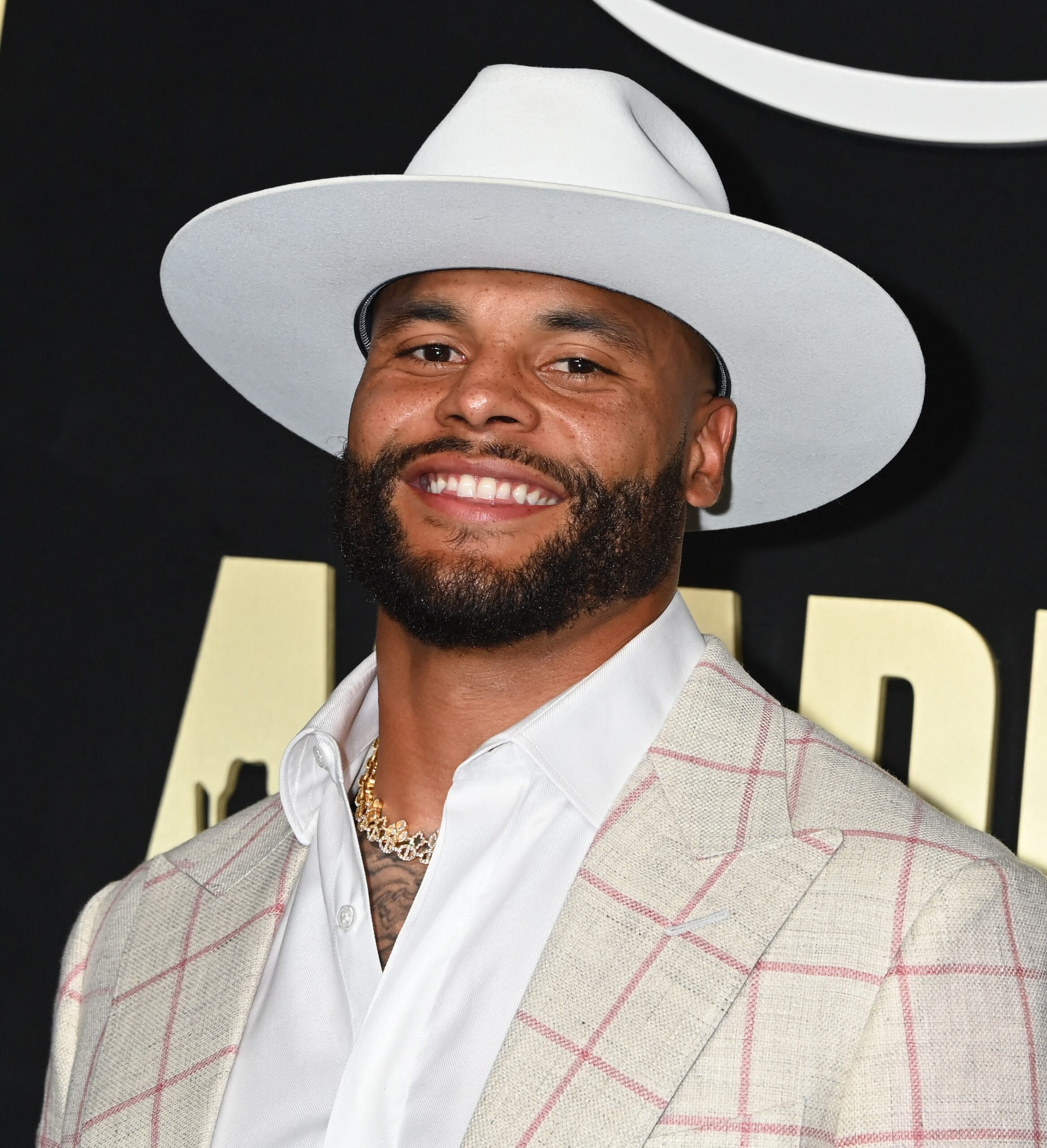 Dak Prescott posing on the red carpet.