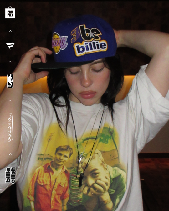 Billie Eilish posing with new NBA hats.