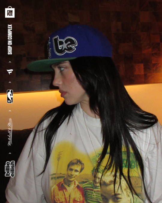 Billie Eilish posing with new NBA hat. 