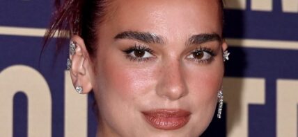 Dua Lipa smirking
