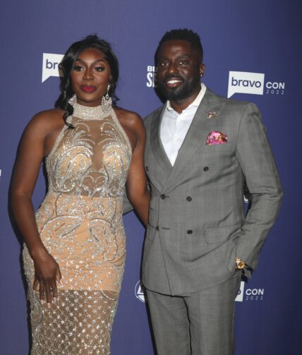 Wendy and Eddie Osefo posing on the red carpet.