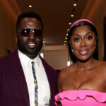 Wendy and Eddie Osefo posing for a photo during BravoCon.