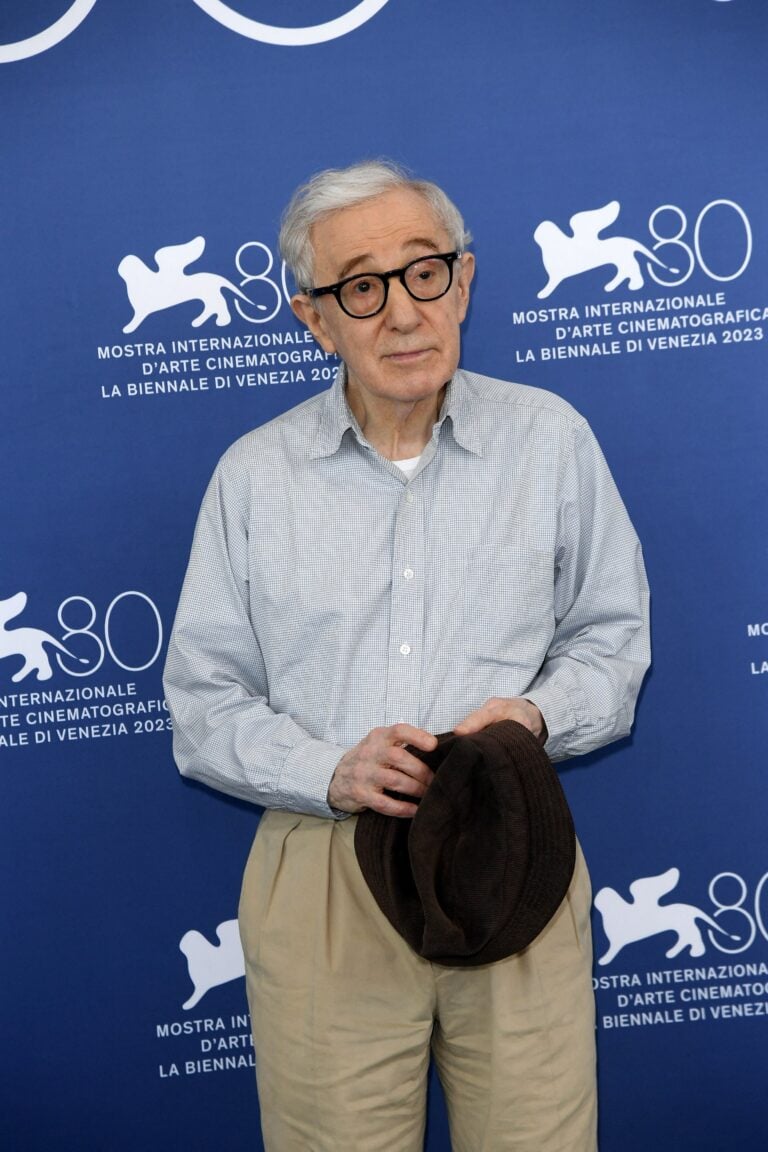 Woody Allen holding a hat
