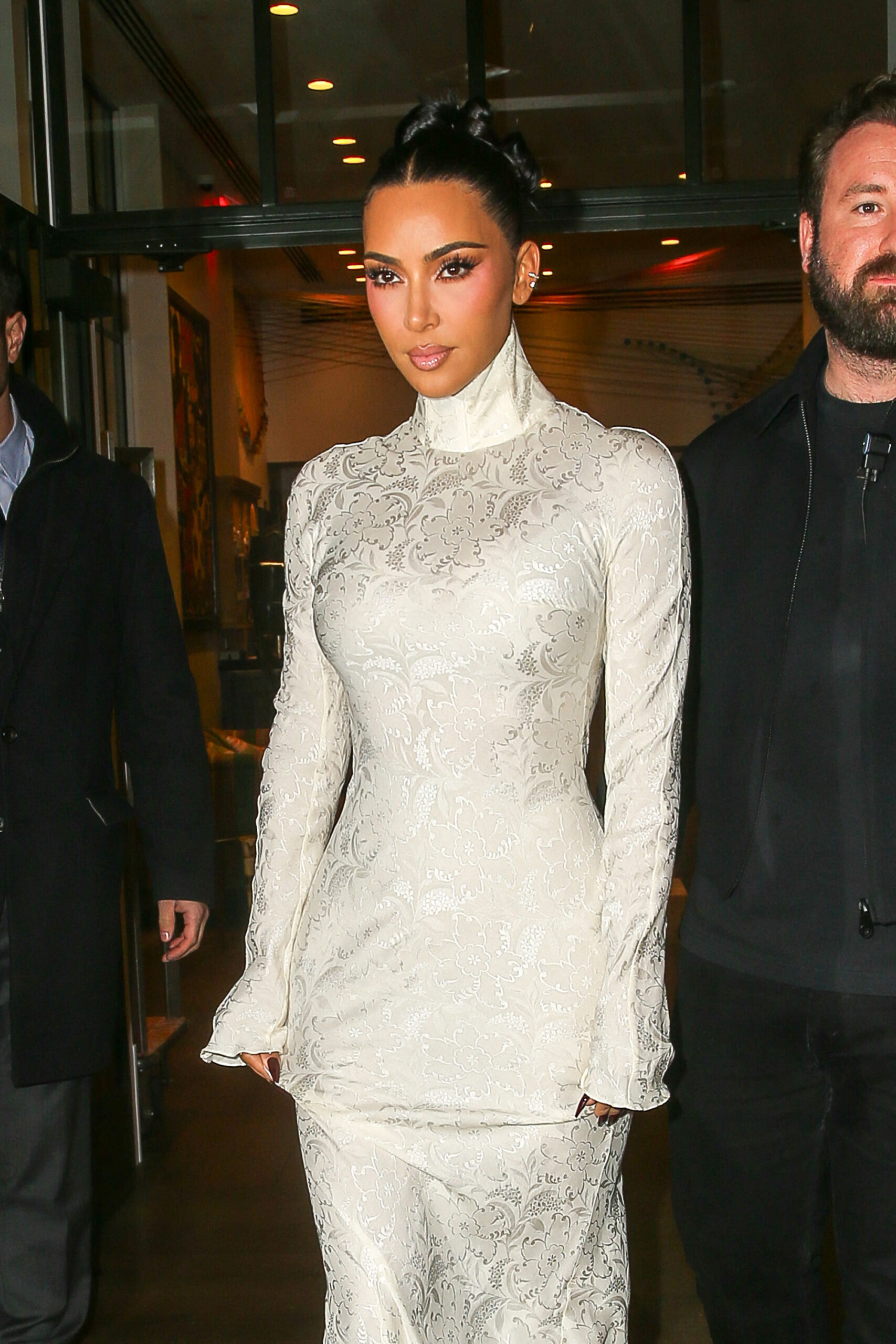 Kim Kardashian wears a white dress as leaving her hotel in NYC on Oct 28, 2025
