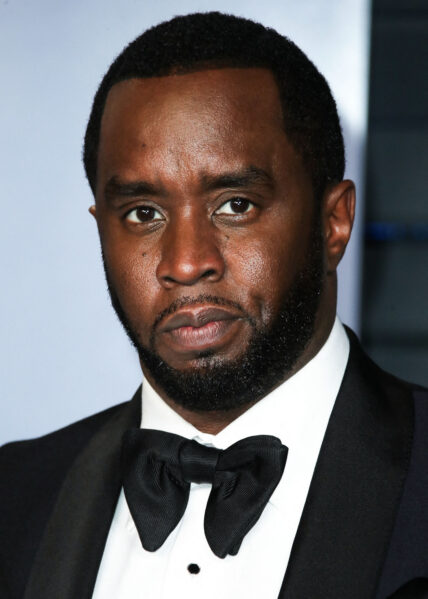 Photo of Diddy posing on the red carpet.