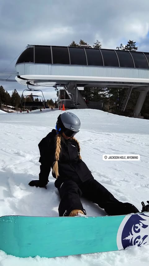 Emily Elizabeth falls while snowboarding