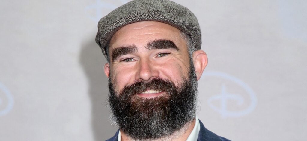 NFL star Jason Kelce posing on the red carpet.