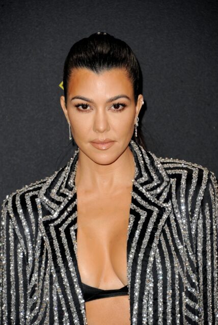 Kourtney Kardashian posing on the red carpet.