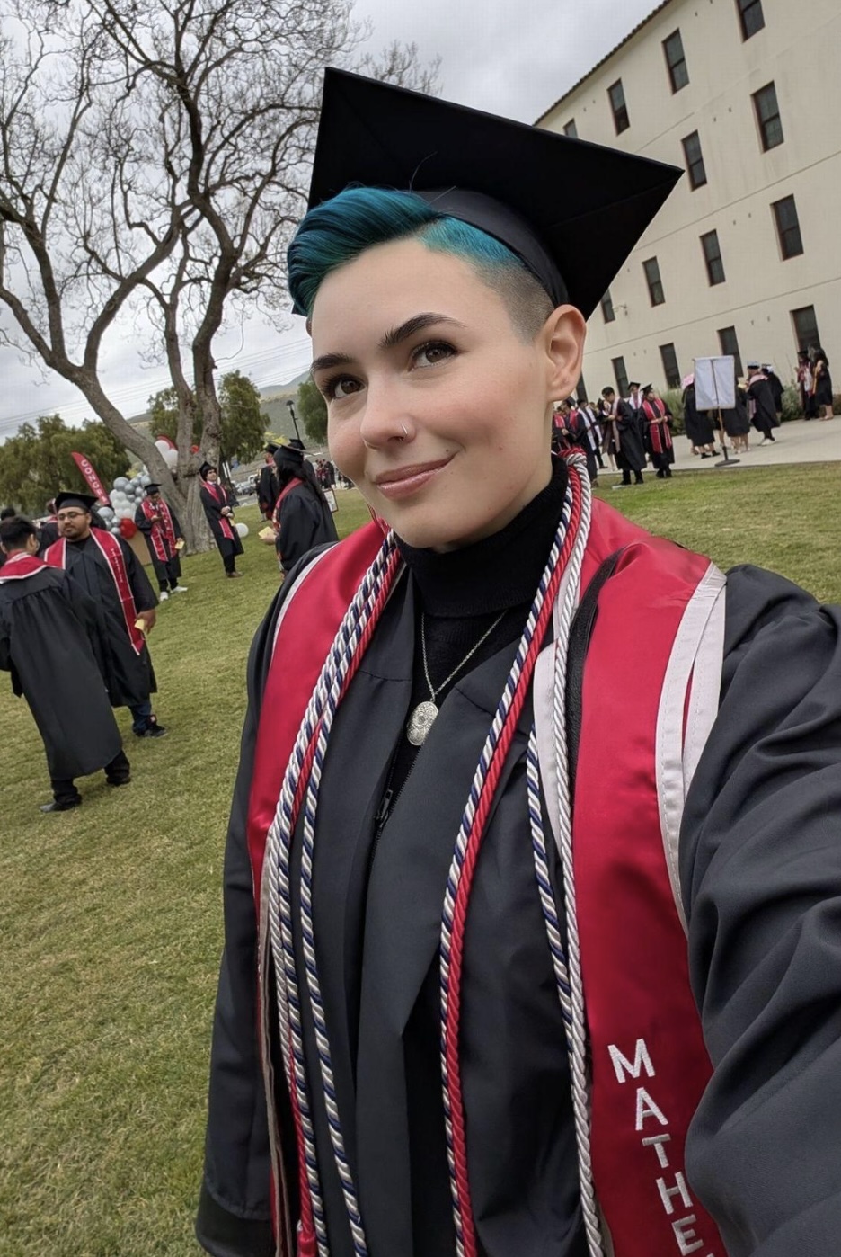 Kit Barrus wearing graduation hat and jacket