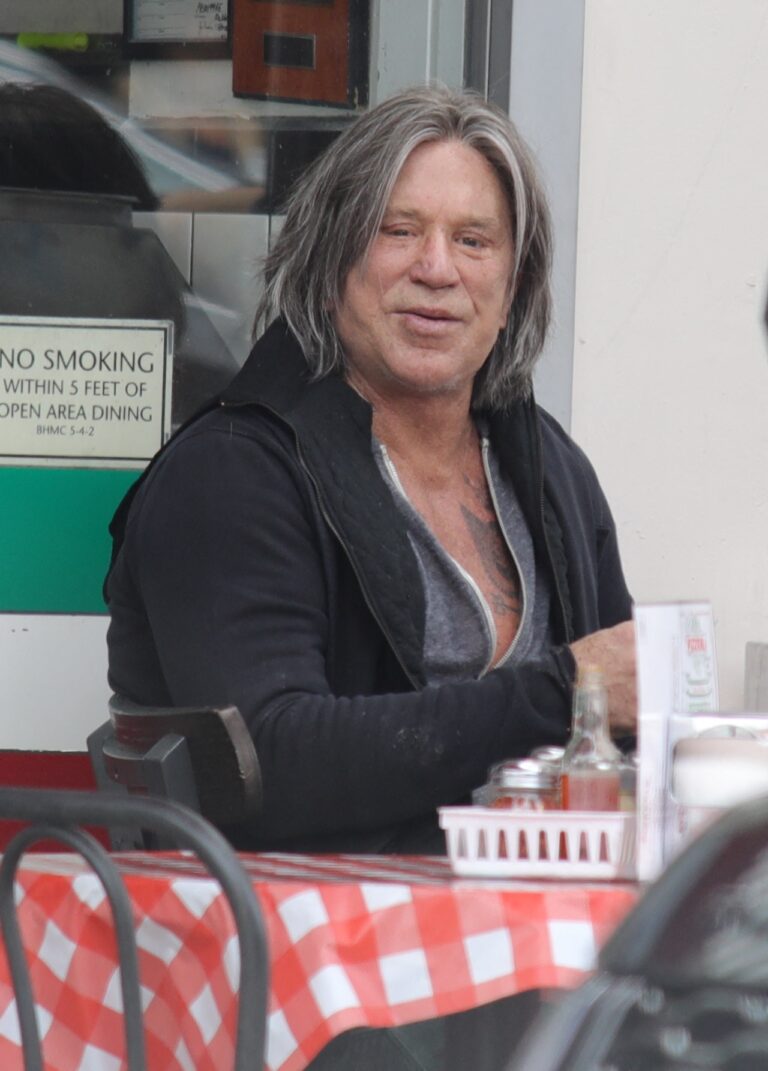 Mickey Rourke seen with long locks in new hairstyle.