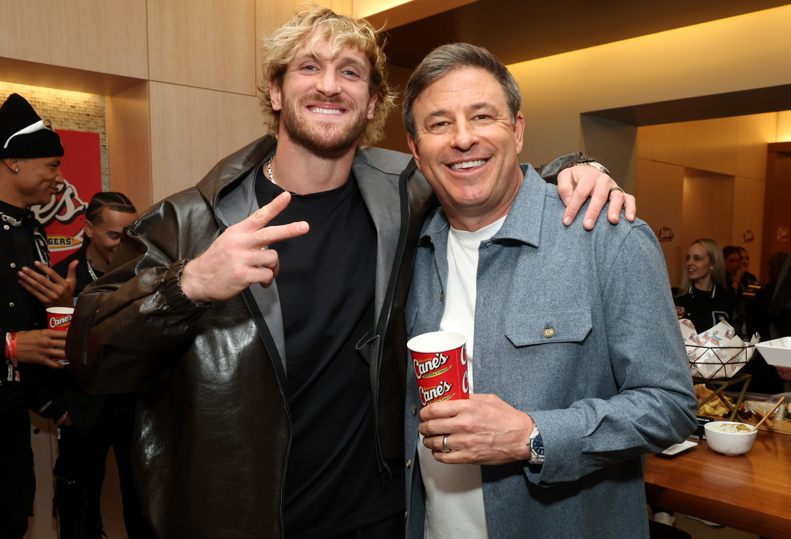 Logan Paul and Todd Graves inside Raising Cane's suite at Super Bowl