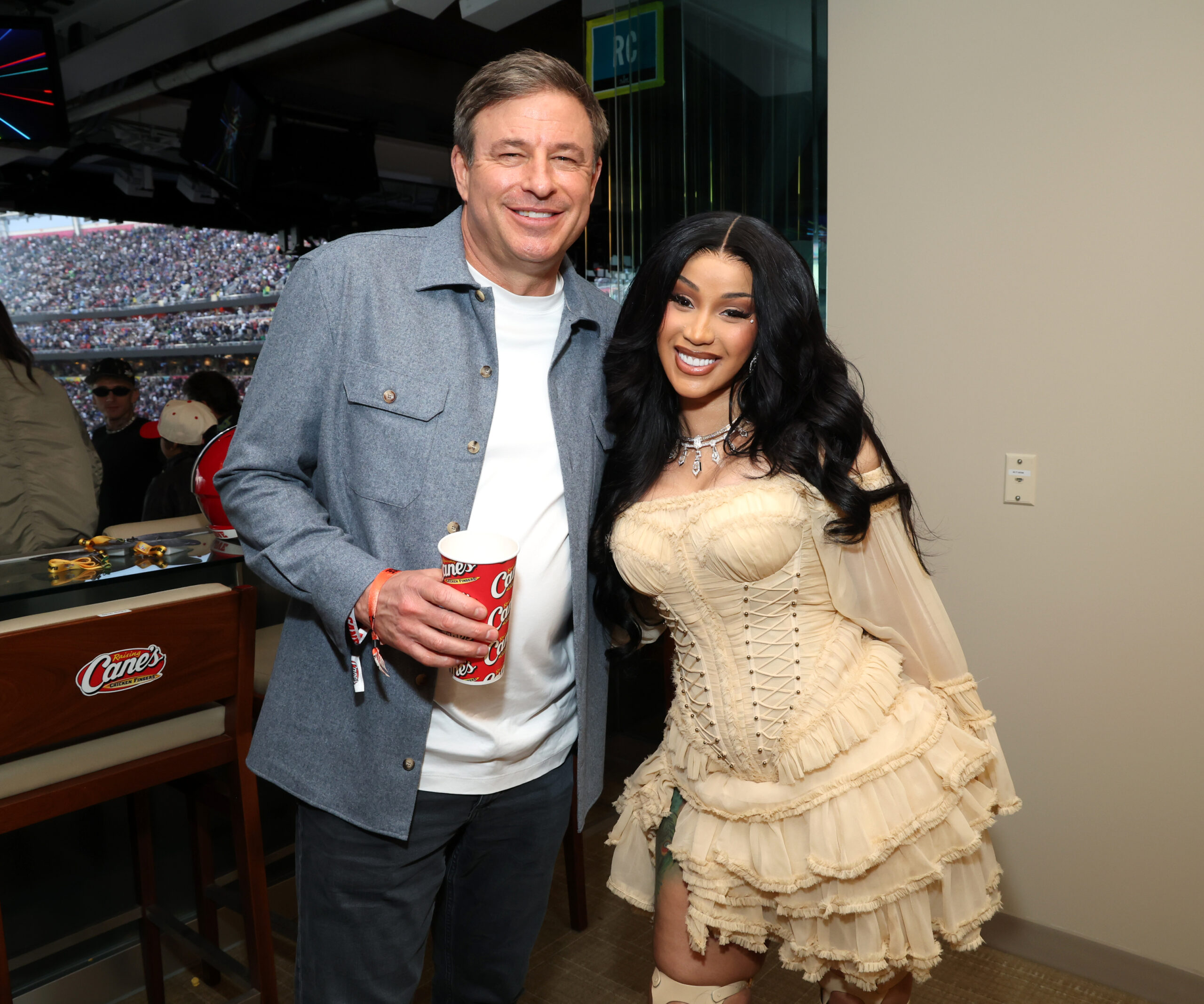 Cardi B and Todd Graves inside Raising Cane's suite at Super Bowl