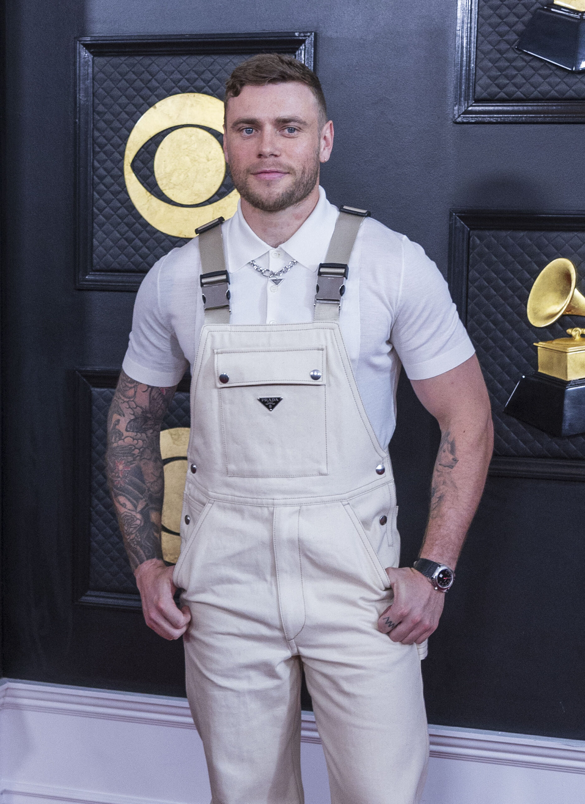 Gus Kenworthy posing on the red carpet. 