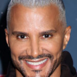 Jay Manuel posing on the red carpet.