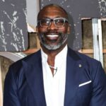 Shannon Sharpe, NFL alum posing on red carpet.