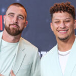 Travis Kelce and Patrick Mahomes posing on the red carpet.
