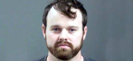 Joseph Duggar booking photo, a married father-of-four and the younger brother of convicted sex offender Josh Duggar was arrested on Wednesday in connection with allegations that he touched a nine-year-old girl on her underwear and genitals.