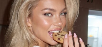Olivia Brand poses with a cookie