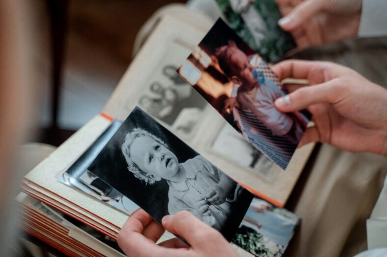 Someone holding old photographs.