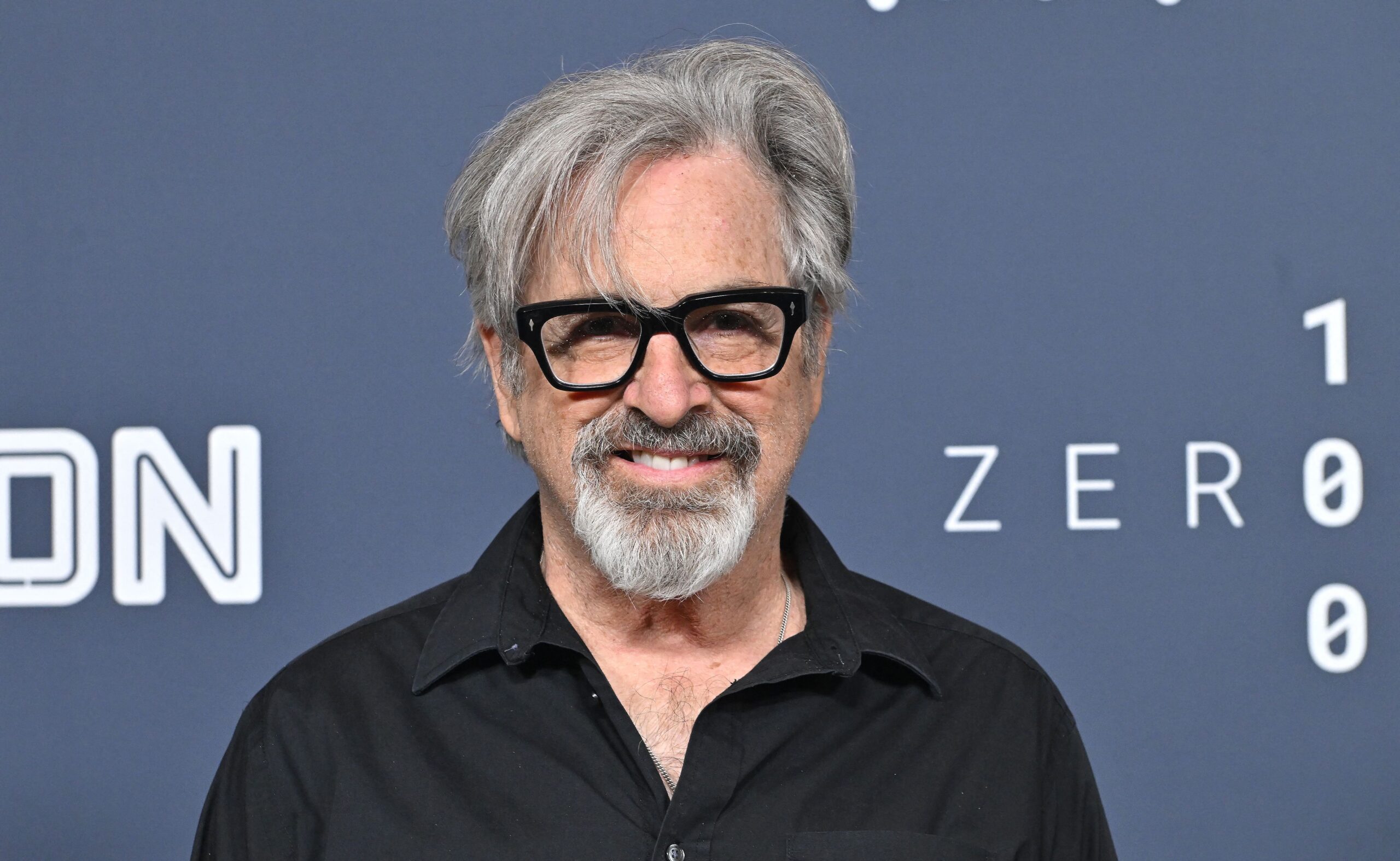 Robert Carradine wearing glasses