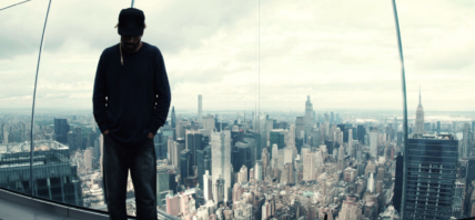 Man standing in front of city skyline