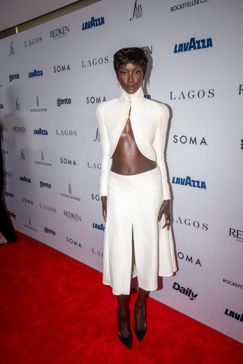 Anok Yai in a white two-piece 