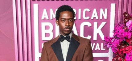 Damson Idris in a brown suit