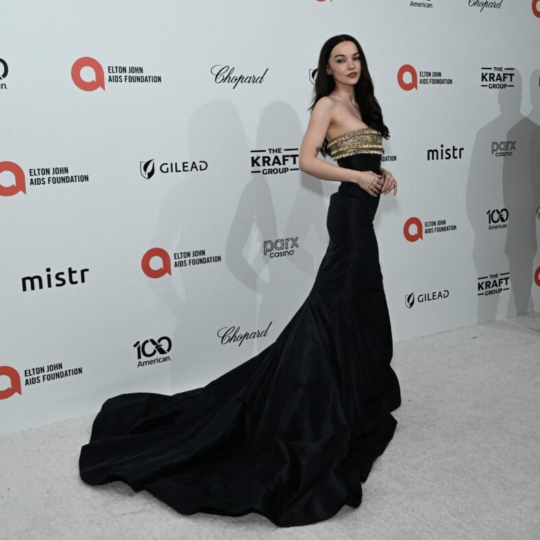 Dove Cameron in a black dress