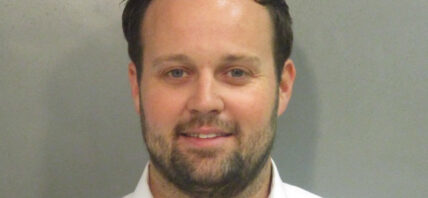 Josh Duggar smiles in new mugshot photograph after being found guilty in child pornography case